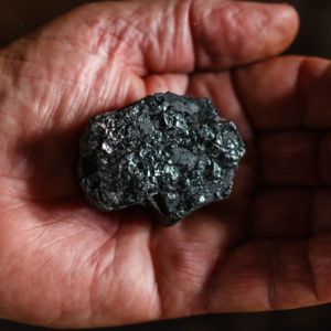 Coal and hand