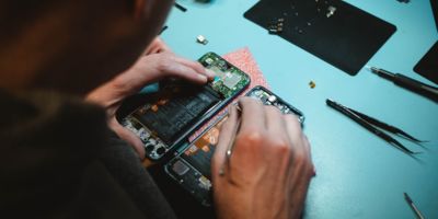 Picture of a person reparing his/her phone