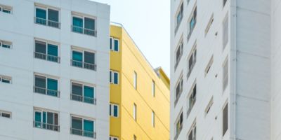 white and yellow apartment buildings