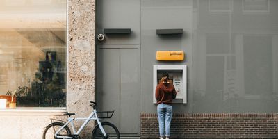 Photo of someone using an ATM