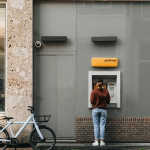 Photo of someone using an ATM