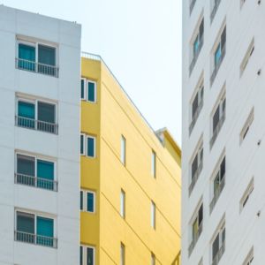 white and yellow apartment buildings