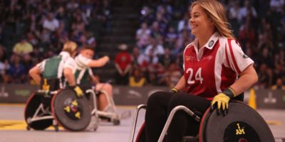 Picture of women in  wheelchair playing basketball