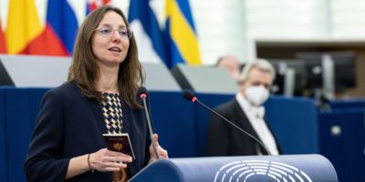 Saskia Bricmont MEP showing her passport