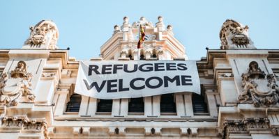 Picture of a façade with banner Refugees welcome