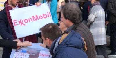 exxon lobby badge media stunt