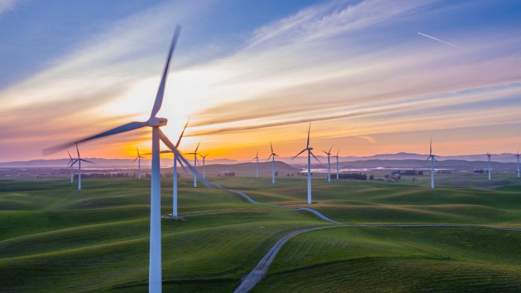 Wind farm on hilly grasslands/ CC0 Rawfilm