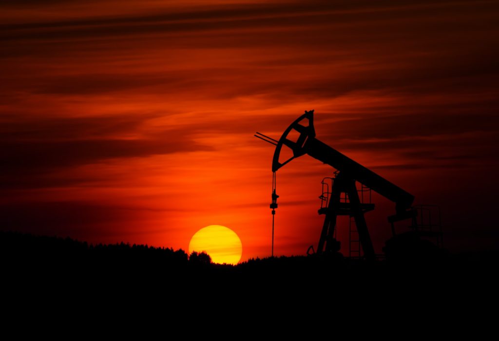 Pumpjack against orange sunset/ CC0 Zbynek Burival