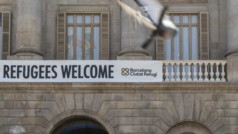 Refugees Welcome sign on Barcelona's city hall balcony