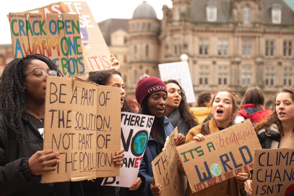 Group of women holding signs/ CC0 callum-shaw