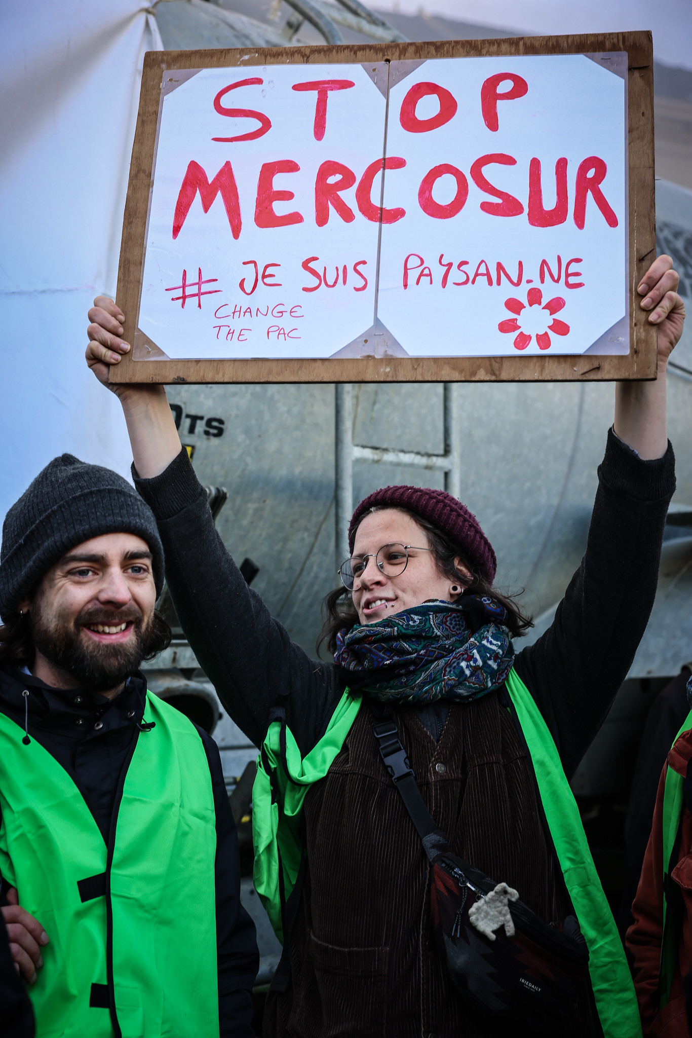 Woman holding a stop mercosur sign EU-Mercosur